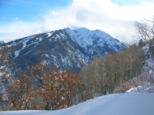 Snowy peaks and ski trails at Aspen Highlands, one of the four Aspen Snowmass mountains