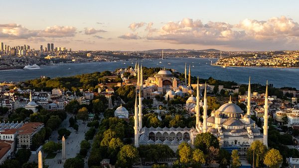 The Blue Mosque and Hagia Sophia with the Bosphorus and modern Istanbul skyline behind