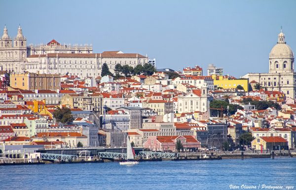 Lisbon's Alfama hillside with the São Vicente de Fora monastery and the National Pantheon dome above the Tagus