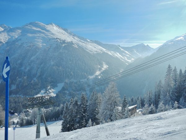 Snowy Arlberg peaks seen past the Galzig lift in the St. Anton ski area